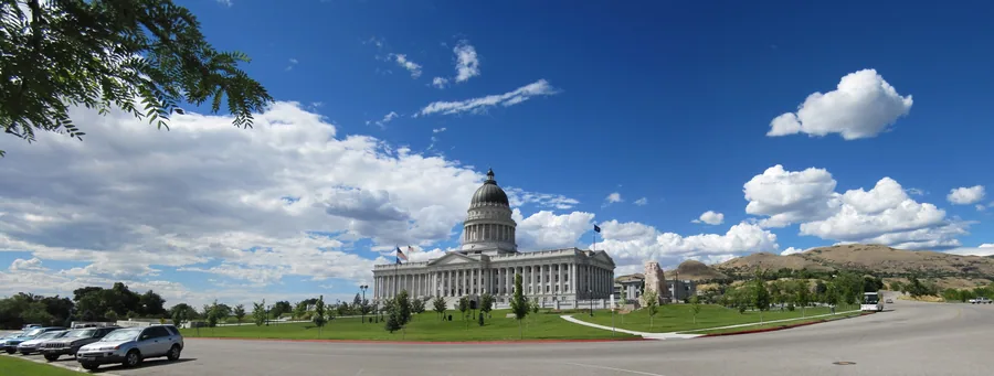 The Utah State Capitol on the bench above downtown, its copper dome and Corinthian columns seen across the lawns.