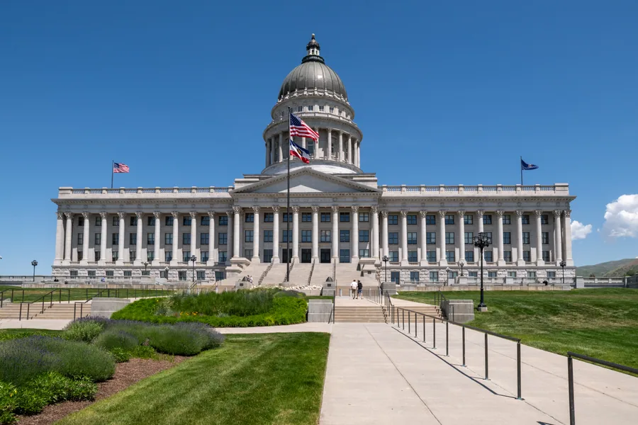 The south front of the Utah State Capitol, columns and dome above a wide flight of steps.