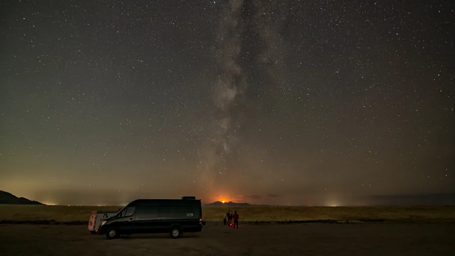 Stargazers under the island's night sky, where the guide's optics come out.