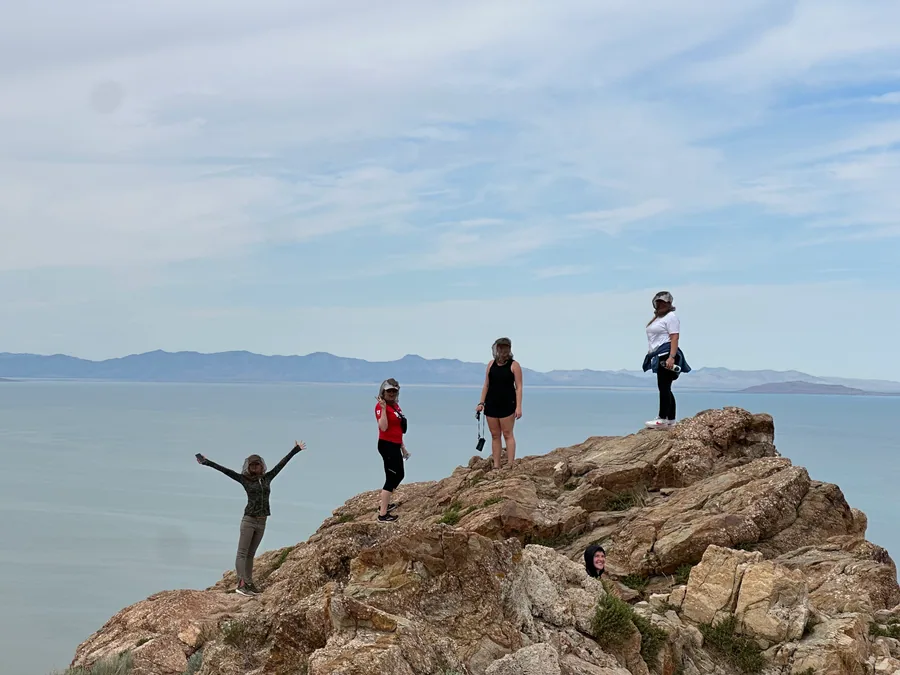 Guests standing on the rocks at Buffalo Point above the Great Salt Lake