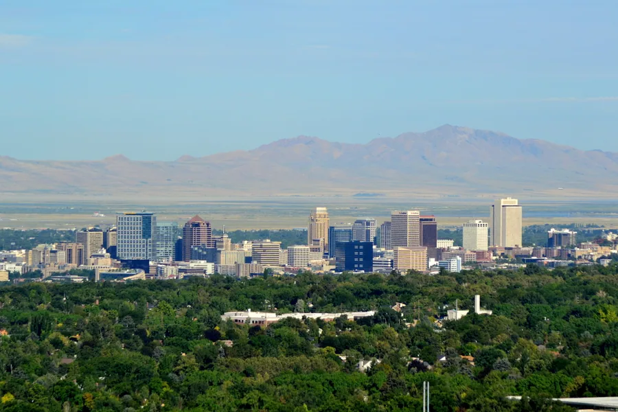 Downtown Salt Lake City seen from the green foothills of the east bench.