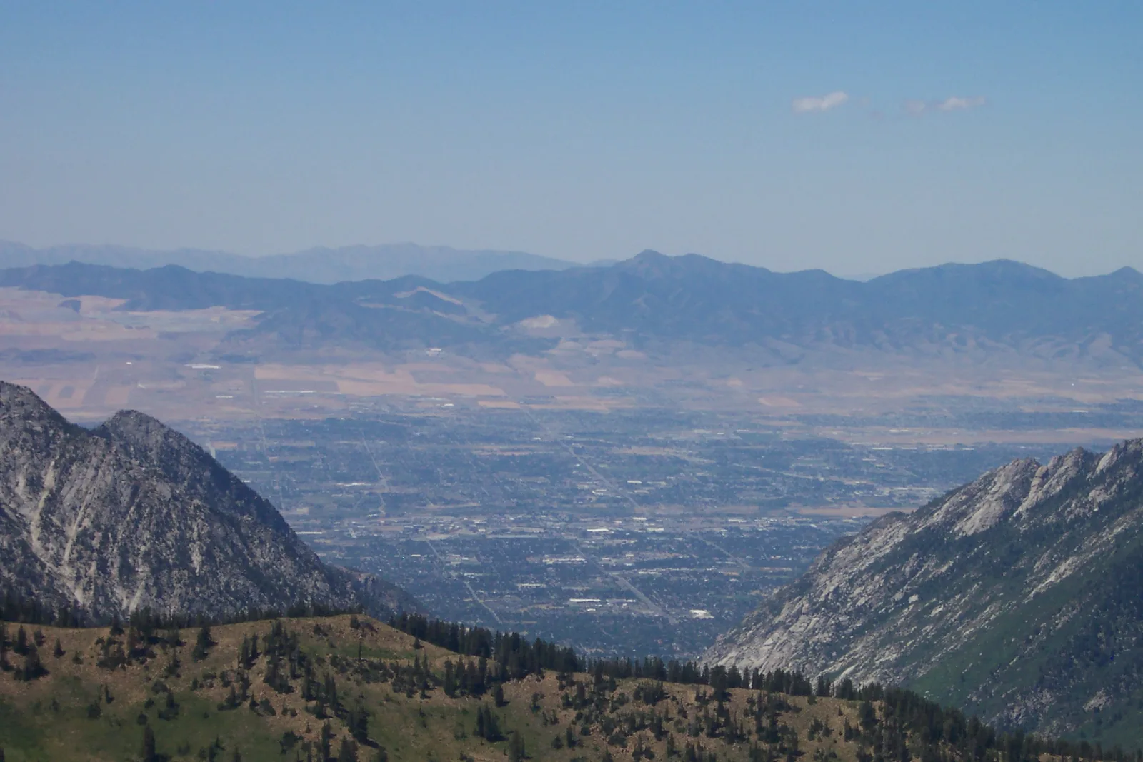 The Salt Lake Valley seen from Hidden Peak at the top of the Snowbird tram, the Wasatch slopes bare of snow in summer.
